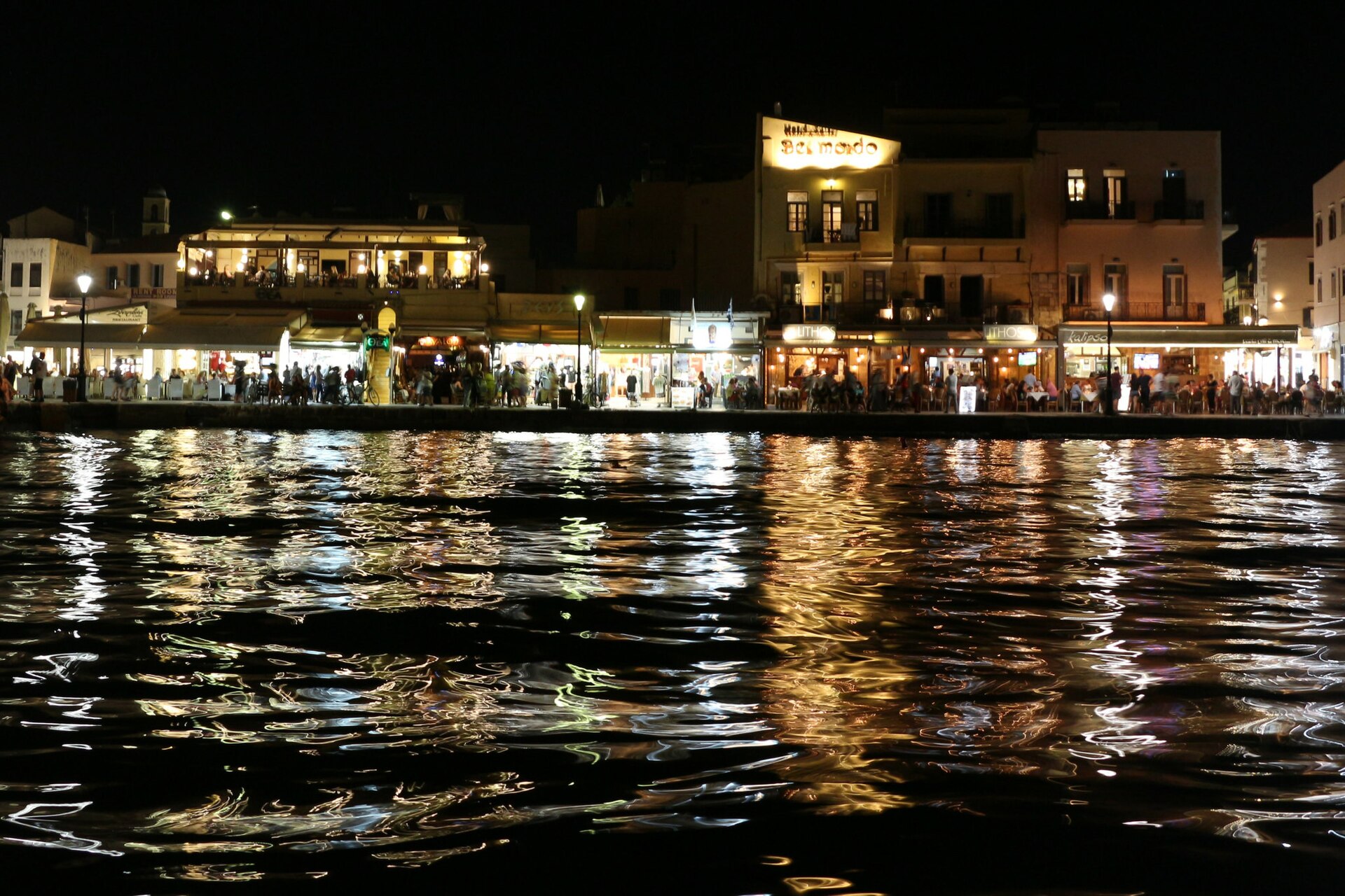 Bars and crowds along Chania's Old Venetian harbour at night